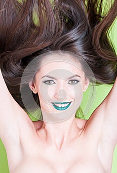 Smiling girl posing skin hair and beauty make-up concept