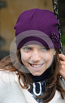 Smiling girl with purple hat