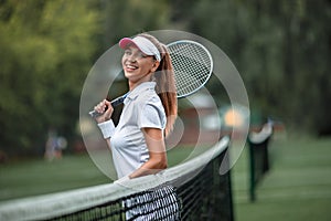 Smiling girl with a racket