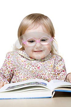 Smiling girl reading book