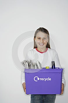 Smiling Girl With Recycling Container