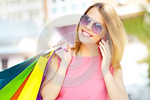 Smiling girl with shopping bags