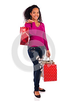 Smiling girl with shopping bags