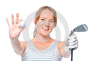 Smiling girl shows a camera in the ball and a golf club