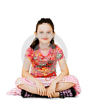 Smiling girl sitting on the floor