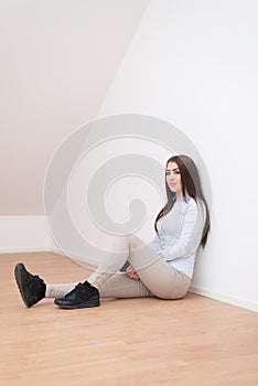 Smiling girl sitting on floor