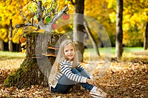 Smiling girl in the autumn park