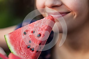 Smiling girl with a slice of watermelon - close up