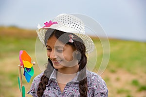 Smiling girl with pinwheel photo