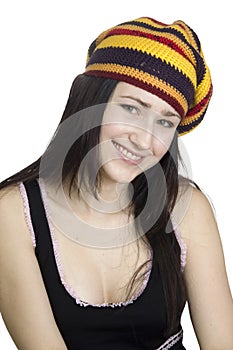 Smiling girl in striped beret on white backgroun