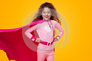 Smiling girl in superhero costume