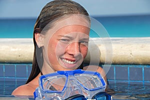 Smiling girl in swimming pool