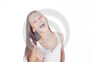 Young girl is brushing her teeth. photo