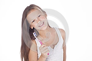 Young girl is brushing her teeth. photo