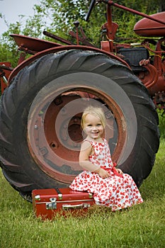 Smiling girl and tractor