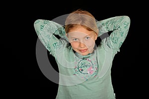 Smiling girl tying hair back