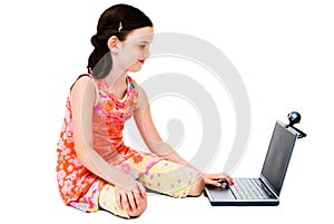 Smiling girl using a laptop