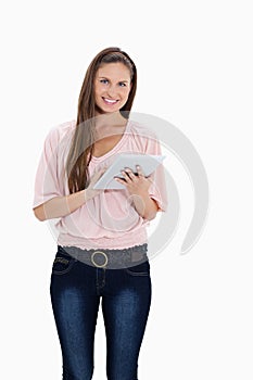 Smiling girl using a touchpad