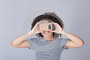 Smiling girl using virtual reality device