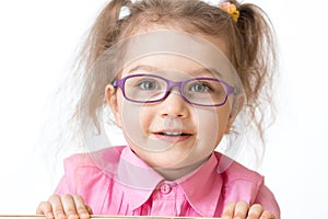 Smiling girl wearing glasses closeup portrait photo