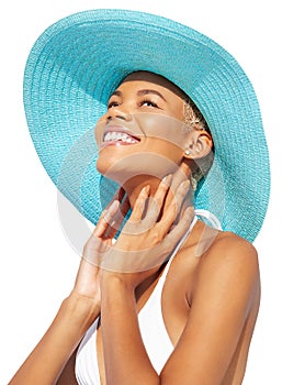 Smiling girl wearing a turquoise sun hat and bikini feels great, African latin American woman isolated on white background.