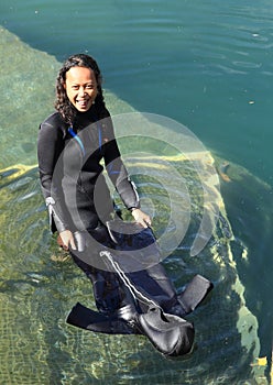 Smiling girl in wetsuit