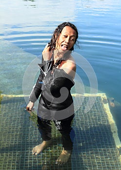 Smiling girl in wetsuit