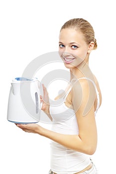 Smiling girl with white kettle on white