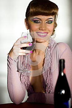 Smiling girl with wineglass