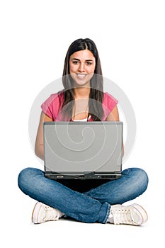 Smiling girl working on laptop