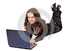 Smiling girl works with the laptop