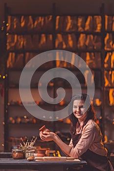 Smiling girl in workshop