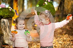 Smiling girls in the autumn park