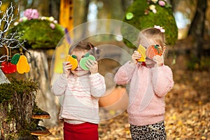 Smiling girls in the autumn park