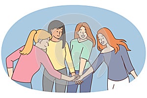 Smiling girls join hands show unity