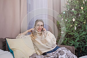 Smiling gorgeous female having cell telephone conversation
