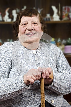 Smiling grandma with stick photo
