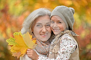 smiling grandmother and granddaughter
