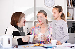 Smiling grandmother, mother and granddaughter