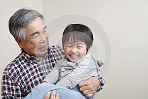 Smiling grandpa and grandson
