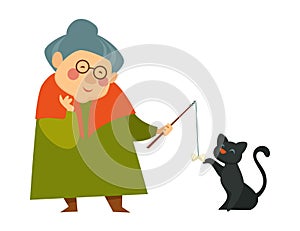 Smiling granny, old lady playing with her black cat