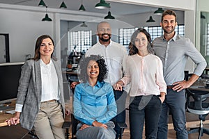 Smiling group of diverse businesspeople working in an office