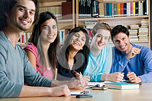 Smiling group of students in a library