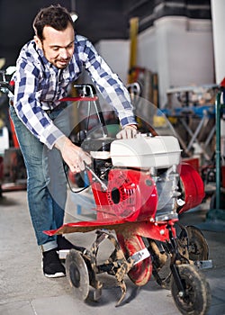 Smiling guy gas plow for work