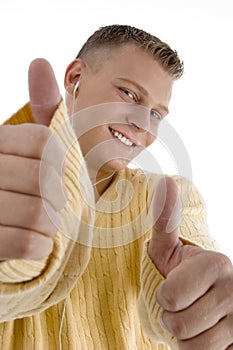 Smiling guy showing good luck sign with both hands