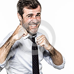 Smiling hairy businessman showing fists for punchy corporate fight