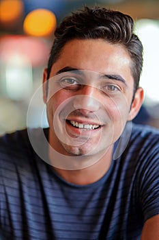 Smiling handsome brunet young man