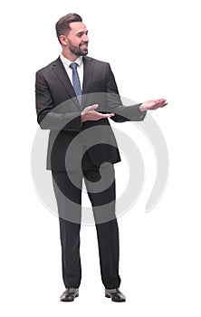 smiling handsome businessman pointing somewhere to the side. isolated on white