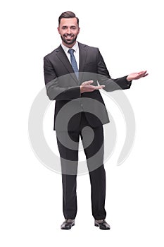 smiling handsome businessman pointing somewhere to the side. isolated on white