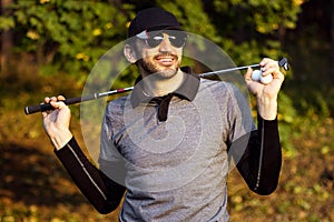 Smiling handsome golfer